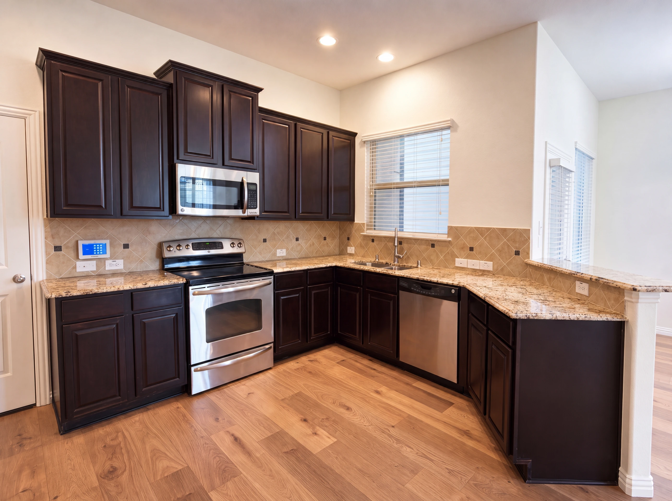 Kitchen with granite counters and 42-inch espresso cabinetry